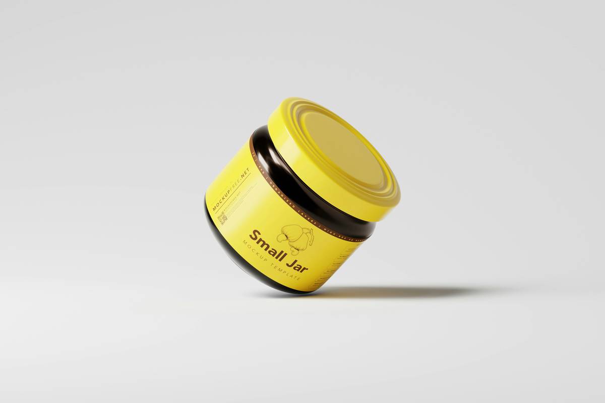 Close-up of hand applying sleek shine pomade to short, dark hair for a glossy, polished finish
